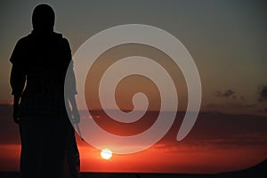 Praying at sunset