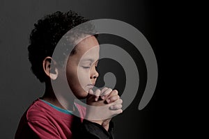 Praying to God with hands together with black background with people stock photo