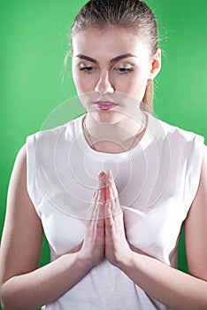 Praying woman on green chroma key
