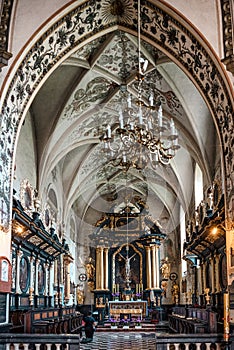 Praying woman kneeling and praying in the church