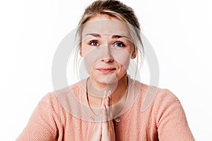 Praying woman touching both hands for patience and softness