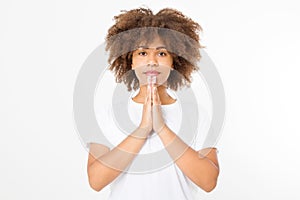 Praying young afro american girl. African woman in summer shirt isolated on white background. Copy space. Mock up. Make a wish