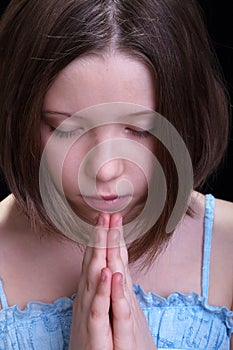 Praying young girl