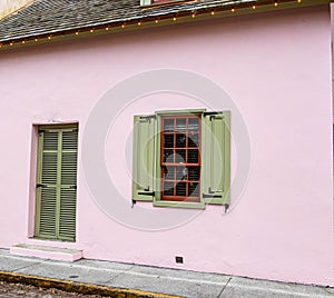 Pre Colonial Pink House With Green Shutters in Old Town