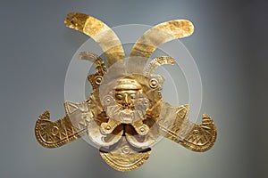 Pre-Columbian gold artifact in the Museo del Oro. Famous Gold Museum, Bogota, Colombia. photo