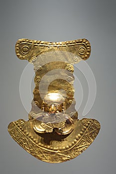 Pre-Columbian gold artifact in the Museo del Oro. Famous Gold Museum, Bogota, Colombia. photo