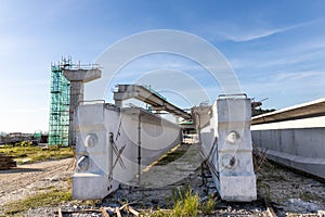 Pre-fabricated concreate beams with mass rail transit line construction in background