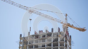 Pre-fabricated structures and products. The construction of a new building, skyscraper, or structure with the help of a crane.