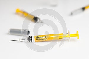 Pre filled heparin syringe on white table