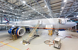 Pre-flight inspection of airplane on maintenance at the airport