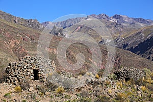 Pre-Incan round houses named colca near Chivay in Peru