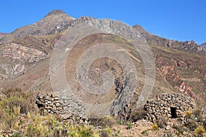 Pre-Incan round houses named colca near Chivay in Peru
