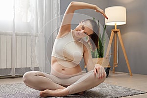 Pre-natal exercises. Prenatal fitness yoga. Healthy pregnancy care. Expecting mother's exercise. Beautiful pregnant woman