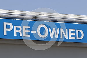 Pre-Owned Cars sign at a used car dealership. As supplies of new cars dwindle, used cars become more popular photo