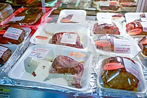 Pre-packed fresh and smoked meat in a supermarket