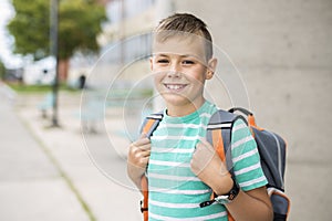 Pre teen boy outside at school