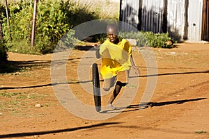 Pre-Teen Boy Playing with Wheel