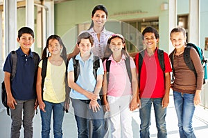 Pre teen schoolchildren with teacher photo