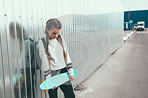 Pre teen skater on the city street