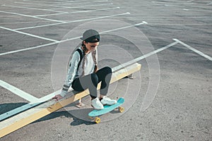 Pre teen skater on the city street