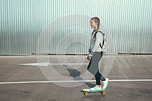 Pre teen skater on the city street