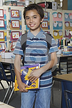 Preadolescent Boy Holding Book