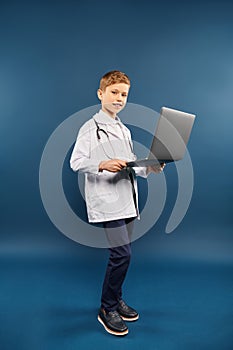 A preadolescent boy in a lab photo