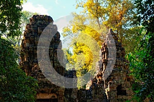 Preah Khan, picturesque ancient towers in the Cambodian autumn forest, landscape