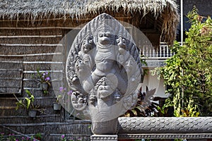 Preah Promaeath pagoda in Siem Reap, Cambodia. Naga stone carving decor. Buddhist temple in Southeast Asia.