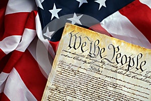 Preamble to the Constitution of the United States and American Flag close up