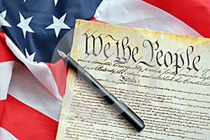 Preamble to the Constitution of the United States and American Flag close up