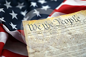 Preamble to the Constitution of the United States and American Flag close up