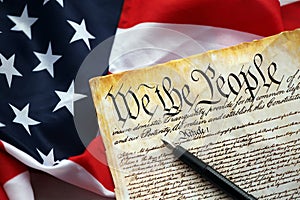 Preamble to the Constitution of the United States and American Flag close up photo