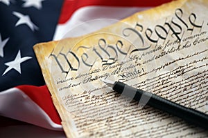 Preamble to the Constitution of the United States and American Flag close up photo