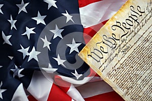 Preamble to the Constitution of the United States and American Flag close up photo