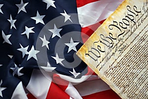 Preamble to the Constitution of the United States and American Flag close up