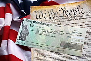 Preamble to the Constitution of the United States and refund check on American Flag