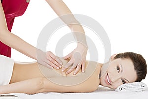 Preaty woman relaxing beeing massaged in spa