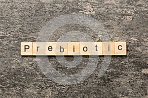 prebiotic word written on wood block. prebiotic text on table, concept