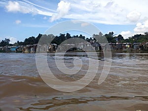 Precarious houses on the banks of the Ozama River