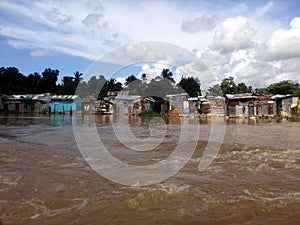 Precarious houses on the banks of the Ozama River