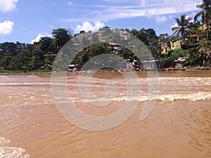 Precarious houses on the banks of the Ozama River