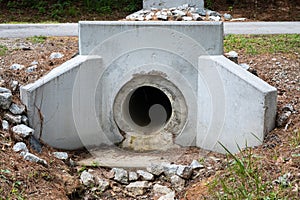 Precast formed concrete headwall for drainage pipe under a street, rainwater runoff culvert