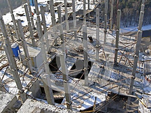Precast reinforced concrete elements of the building, view from above. A frame made of columns and slabs on a