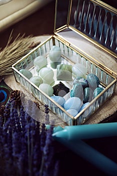 Precious crystal jewelry box with semi-precious stones in green and turquoise tones.