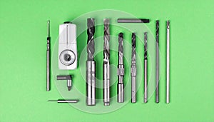 Precision CNC Machining Tools on a Green Background