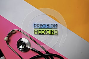 Precision Medicine text on sticky notes with color office desk. Healthcare/Medical concept