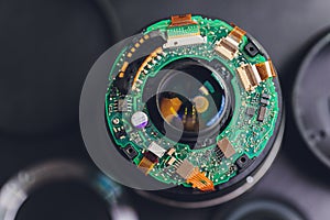 Precision prime optical dslr lens service, adjustment and alignment. Camera lens repair set in photo engineer workplace