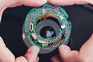 Precision prime optical dslr lens service, adjustment and alignment. Camera lens repair set in photo engineer workplace