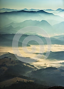 Predawn time in the highlands. mountain silhouettes in the fog